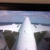 A350では尾翼からの映像がリアルタイムで放映される。那覇空港を飛び立つシーン