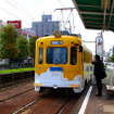 阪堺電軌は2015年カレンダーで使用する写真のフォトコンテストを行っている。写真は阪堺電軌の大小路停留場。