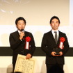 キャップスアソシエーションの成田裕一郎氏（写真左）。映文連アワード表彰式にて。