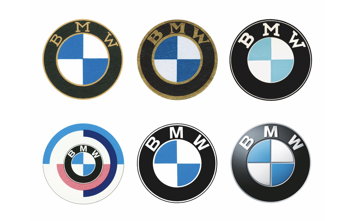 BMWロゴマークの変遷。上段左から右へ1917年、1933年、1954年、下段左から右へ1974年（BMWモータースポーツ）、1979年、2007年。