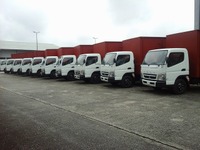 三菱ふそう、ナイジェリア大手飲料メーカーに『キャンター』50台を納車 画像