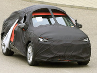 アウディの最新EV『Q6 e-tronスポーツバック』、覆面姿でもわかるクーペSUVのシルエット 画像