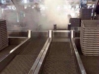 チェックインカウンターでかばん炎上　バンコク空港 画像