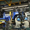 水島工場の生産ラインを流れる新型軽自動車