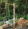 最も被害が大きい海浦～佐敷間の佐敷トンネルの状況（7月30日時点）。5m程度の土砂に埋まった電力線用の支柱。