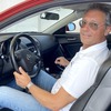 RX-8のシートに収まるラッツェーリ社長