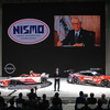 スクリーン左はNISMO創立時のロゴ。右は初代社長の難波靖治氏