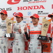 左からGT300優勝の中山、新田、GT500優勝の野尻、伊沢。