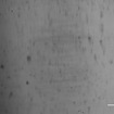 吸収剤なしのゴムを特殊試験機で撮影した接地面の画像。黒い部分（真実接触部）が少なくほとんど接触していない。