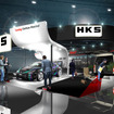 024年の新作グッズも販売！ HKSがカーボンニュートラルを見据えた各種新商品や車両を展示…東京オートサロン2024