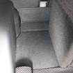 写真では見えないがラゲッジのフロア下にはサブウーファー用のパワーアンプであるキッカーKXA1200.1がインストールされている。