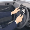 ながら運転（イメージ）