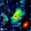 国立天文台野辺山ミリ波干渉計（NMA）で1993年に観測されたおうし座HL星の周囲の様子とアルマ望遠鏡画像の比較