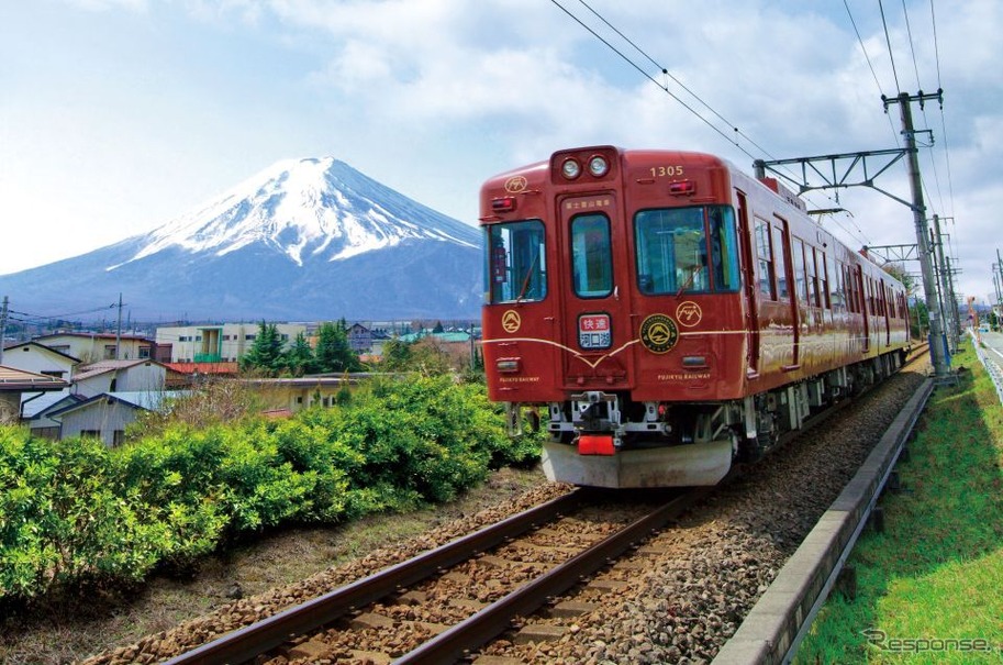 富士急は「富士急沿線から見える富士山・くらしの風景」をテーマにしたフォトコンテストを実施する。写真は富士山をバックに走る「富士登山電車」。